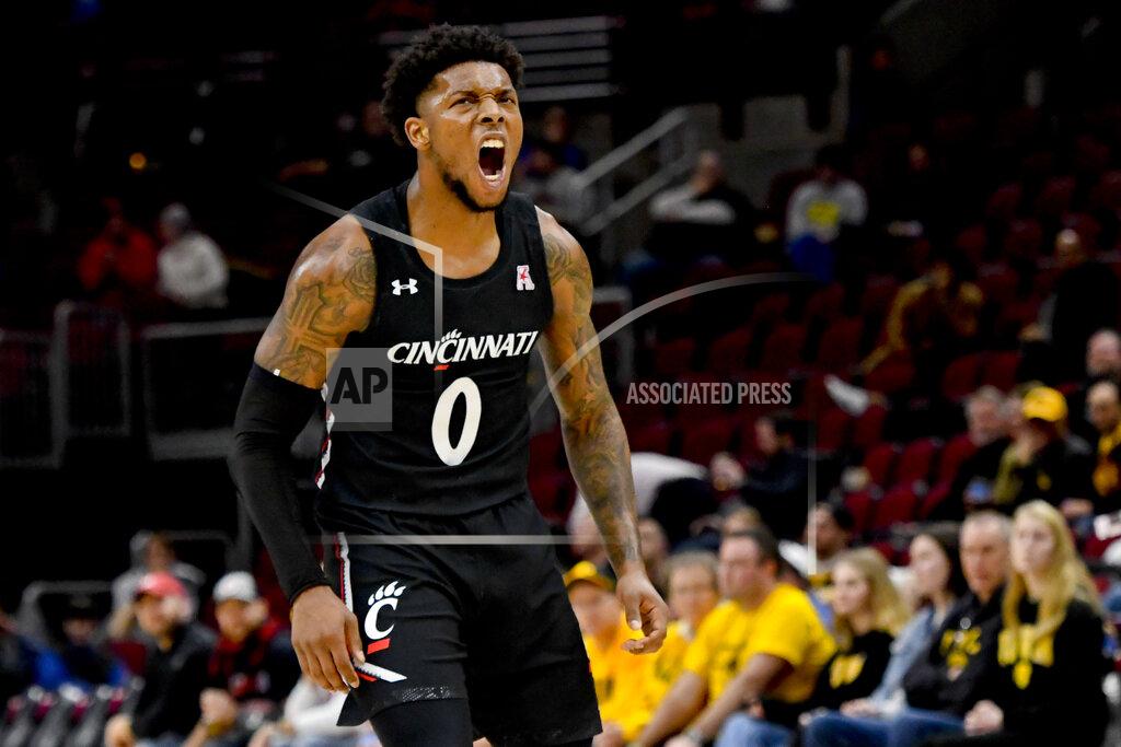 Matt Marton Cincinnati guard Chris McNeal (0) yells during the second half of the team's NCAA college basketball game against Iowa, Saturday, Dec. 21, 2019, in Chicago. (AP Photo/Matt Marton)