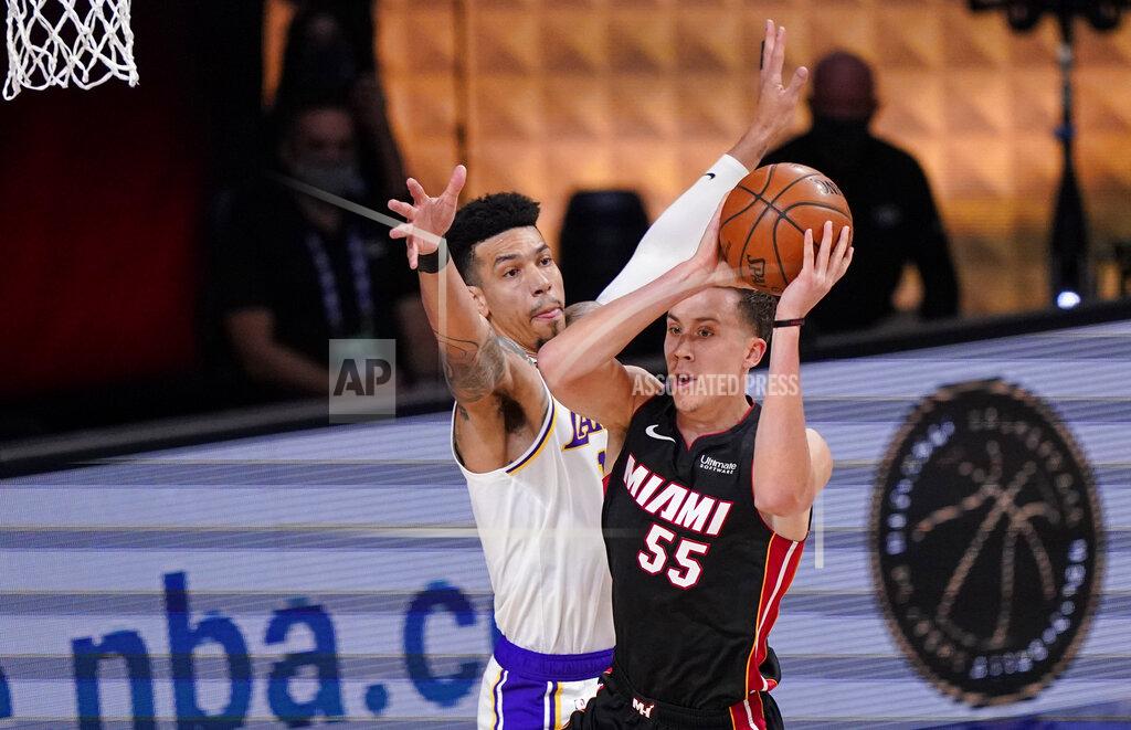 Mark J. Terrill Miami Heat's Duncan Robinson (55) passes the ball against Los Angeles Lakers' Danny Green (14) during the first half in Game 3 of basketball's NBA Finals, Sunday, Oct. 4, 2020, in Lake Buena Vista, Fla. (AP Photo/Mark J. Terrill)