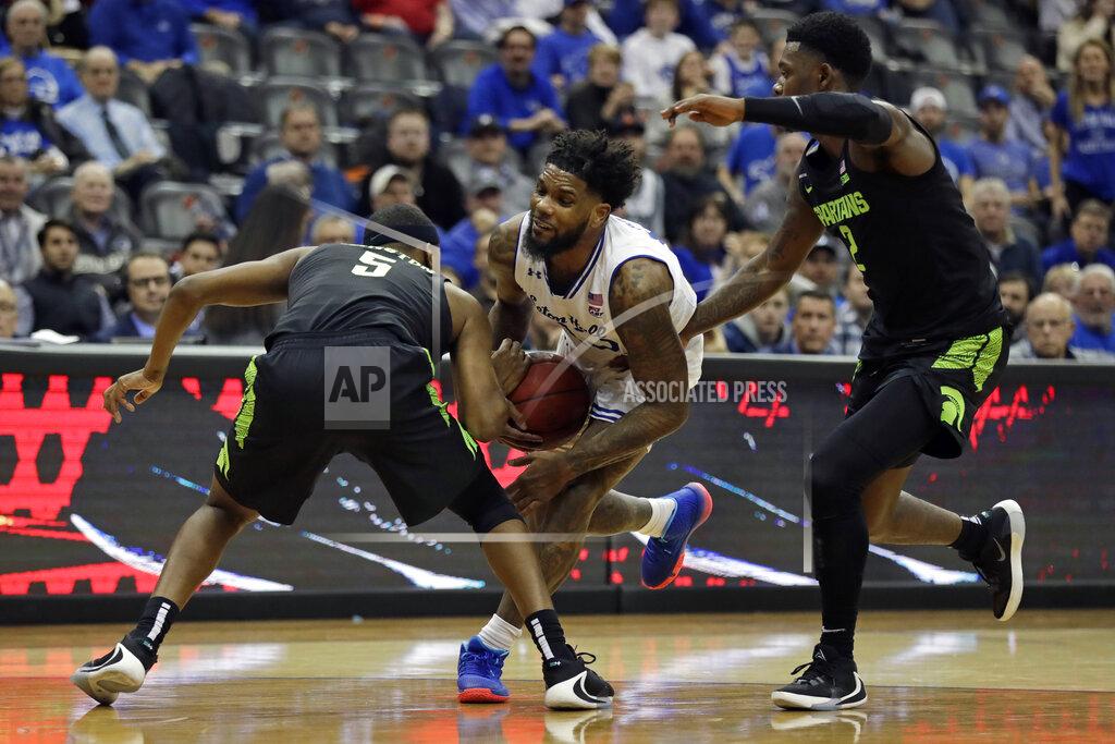 Adam Hunger Seton Hall guard Myles Powell drives to the basket between Michigan State guards Cassius Winston (5) and Rocket Watts (2) during the second half of an NCAA college basketball game Thursday, Nov. 14, 2019, in Newark, N.J. (AP Photo/Adam Hunger)