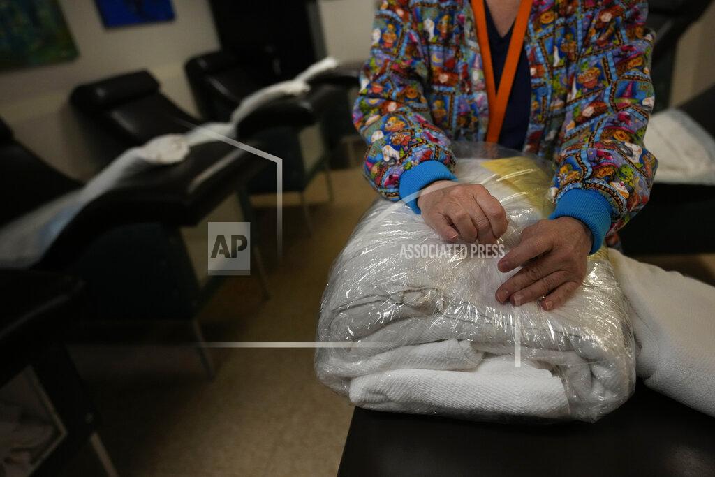 Rebecca Blackwell A nurse sets up beds for women to rest before and after their abortions at the start of the workday, Saturday, Oct. 9, 2021, at Hope Medical Group for Women in Shreveport, La. The nation's most restrictive abortion law is driving many women from Texas to seek services in neighboring states. The abortion clinic in Shreveport is among the clinics being inundated. (AP Photo/Rebecca Blackwell)