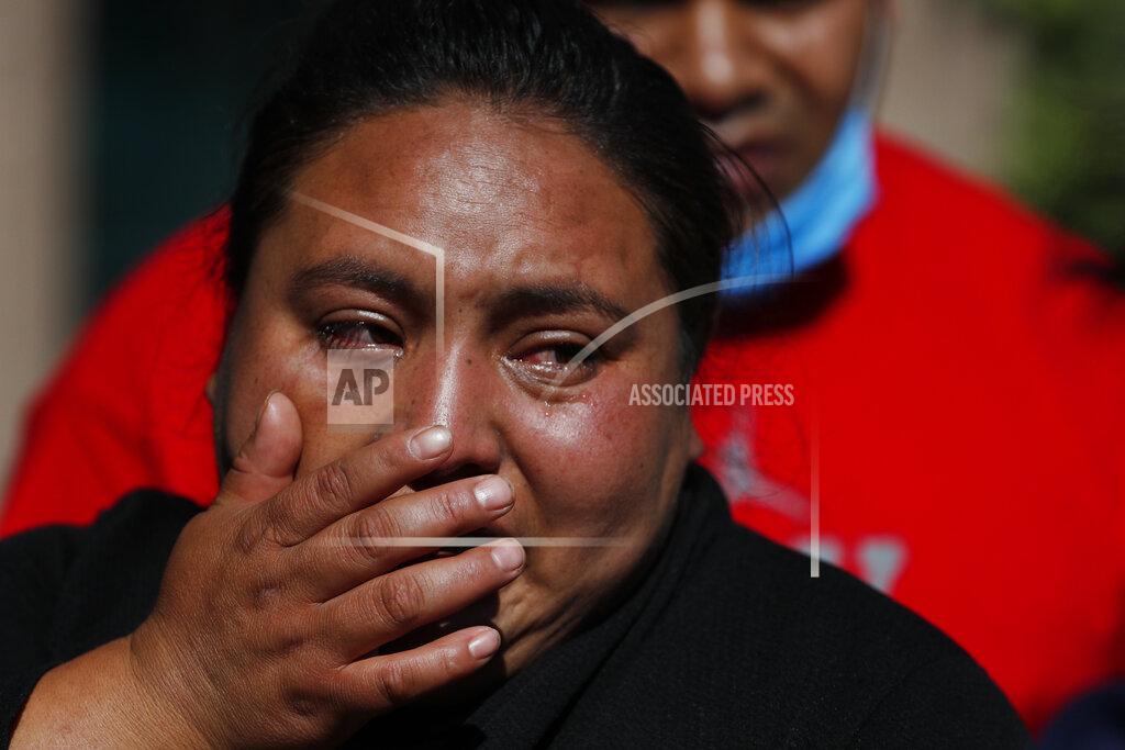 Rebecca Blackwell Gabriela Gomez cries after her sister Rosa Gomez was killed at the scene where police chief Omar García Harfuch was attacked by gunmen in Mexico City, Friday, June 26, 2020. Heavily armed gunmen attacked and wounded Mexico City's police chief in an operation that left several people dead. (AP Photo/Rebecca Blackwell)