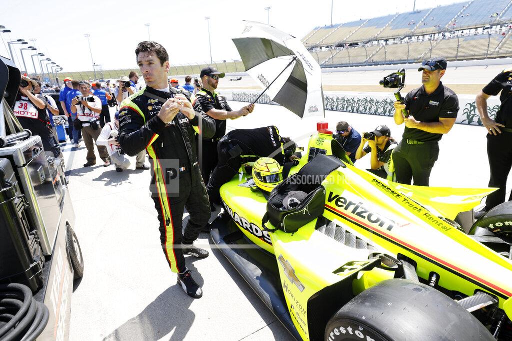 Charlie Neibergall Simon Pagenaud stands next to his car during qualifying for the IndyCar Series auto race Friday, July 19, 2019, at Iowa Speedway in Newton, Iowa. (AP Photo/Charlie Neibergall)