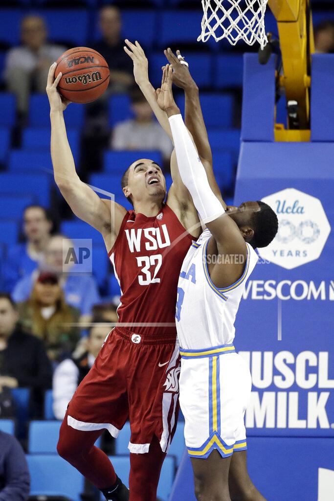 Marcio Jose Sanchez Washington State forward Tony Miller (32) shoots over UCLA guard Prince Ali during the first half of an NCAA college basketball game Thursday, Feb. 13, 2020, in Los Angeles. (AP Photo/Marcio Jose Sanchez)