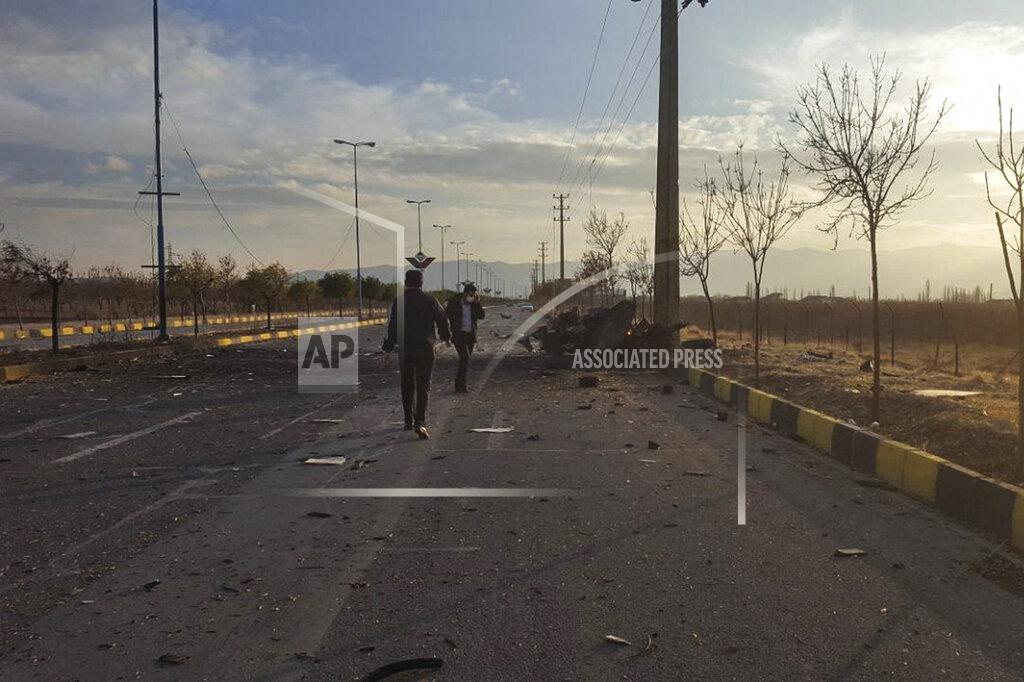 This photo released by the semi-official Fars News Agency shows the scene where Mohsen Fakhrizadeh was killed in Absard, a small city just east of the capital, Tehran, Iran, Friday, Nov. 27, 2020. Fakhrizadeh, an Iranian scientist that Israel alleged led the Islamic Republic's military nuclear program until its disbanding in the early 2000s was “assassinated” Friday, state television said. (Fars News Agency via AP)