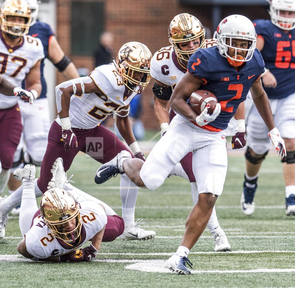 Holly Hart Illinois running back Reggie Corbin (2) breaks a tackle to score Illinois' first touchdown of the game against Minnesota in the first half of an NCAA college football game, Saturday, Nov. 3, 2018, in Champaign, Ill. (AP Photo/Holly Hart)