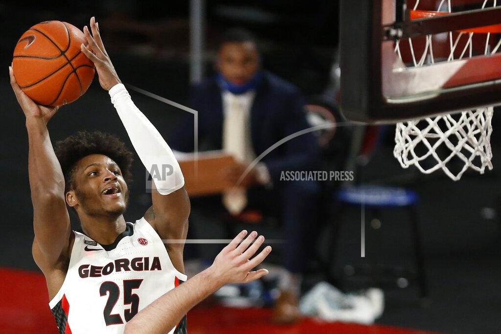 Joshua L. Jones Georgia's Tyron McMillan (25) shoots against North Georgia during an NCAA college basketball exhibition game in Athens, Ga., Wednesday, Dec. 2, 2020. (Joshua L. Jones/Athens Banner-Herald via AP)