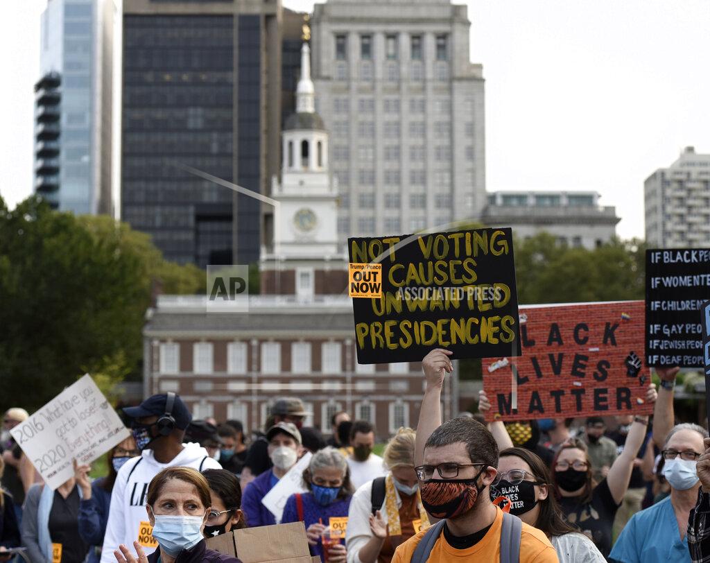 Michael Perez People gather at Independence Mall to protest U.S. President Donald Trump as he visits the National Constitution Center to participate in the ABC News town hall, Tuesday, Sept. 15, 2020, in Philadelphia. (AP Photo/Michael Perez)