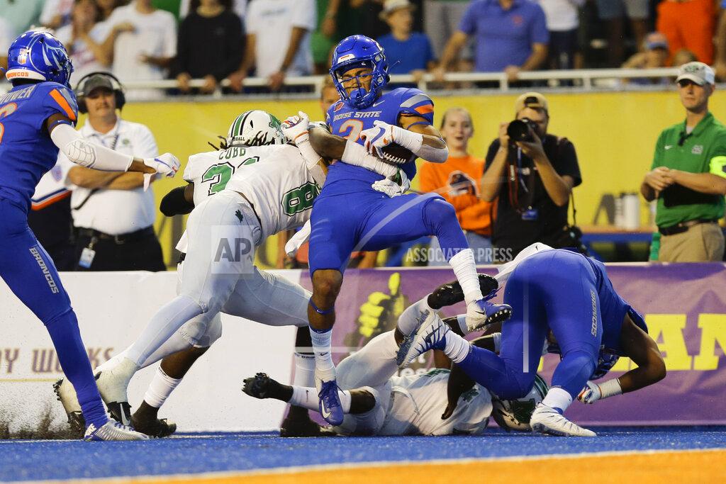 Otto Kitsinger Boise State wide receiver Khalil Shakir, center, is stopped just short of the goal line after a long run during the first half of an NCAA college football game against Marshall in Boise, Idaho, Friday, Sept. 6, 2019. (AP Photo/Otto Kitsinger)