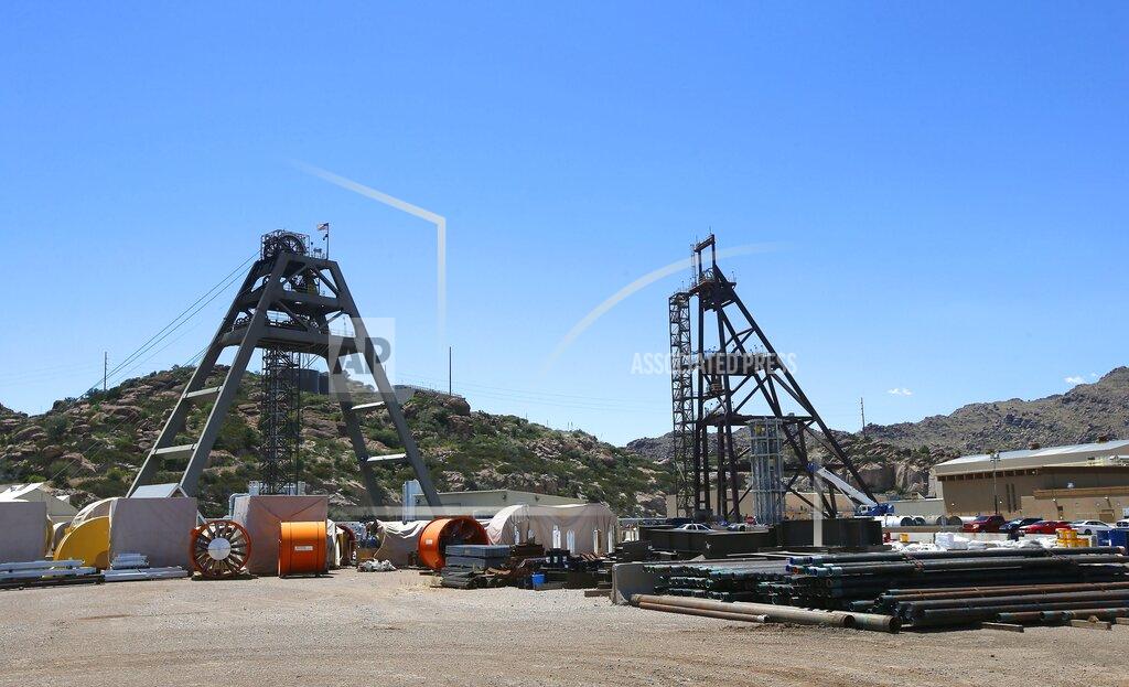 Ross D. Franklin FILE - This file photo taken Monday, June 15, 2015, shows the Resolution Copper Mining area Shaft #9, right, and Shaft #10, left, that awaits the expansion go ahead in Superior, Ariz. The U.S. Forest Service released an environmental review Friday, Jan. 15, 2021, that paves the way for the creation of one of the largest copper mines in the United States, against the wishes of a group of Apaches who have been trying for years to stop the project. The mountainous land near Superior is known as Oak Flat or Chi'chil Bildagoteel. It's where Apaches have harvested medicinal plants, held coming-of-age ceremonies, and gathered acorns for generations. (AP Photo/Ross D. Franklin, File)