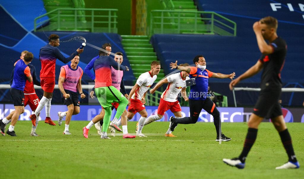 Lluis Gene RB Leipzig players celebrate after winning their Champions League quarterfinal match against Atletico Madrid at the Jose Alvalade stadium in Lisbon, Portugal, Thursday, Aug. 13, 2020. (Lluis Gene/Pool Photo via AP)