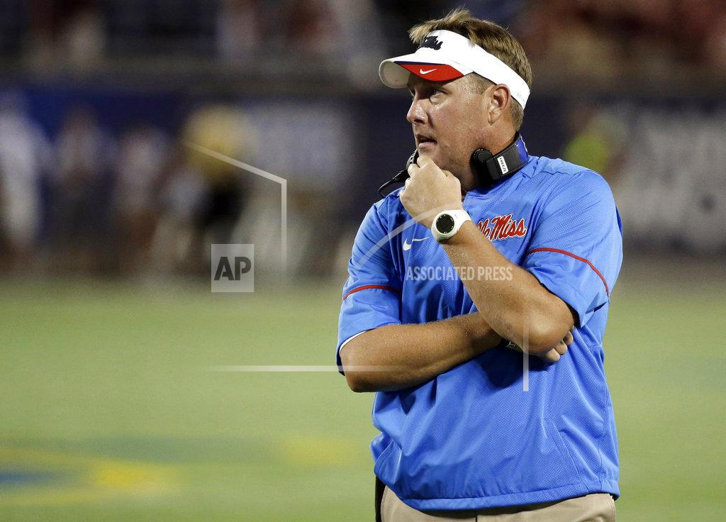 John Raoux FILE - In this Sept. 5, 2016, file photo, Mississippi head coach Hugh Freeze has a moment to himself during a timeout during the first half of an NCAA college football game against Florida State, in Orlando, Fla. Liberty has hired former Mississippi coach Hugh Freeze to lead its football program. A person familiar with the situation told The Associated Press that the Flames have tabbed Freeze as their next coach. The person spoke to the AP on the condition of anonymity because neither the school nor Freeze has publicly announced the decision. Liberty has scheduled a news conference to "name Liberty's next head football coach" for Friday afternoon, Dec. 7, 2018. (AP Photo/John Raoux, File)