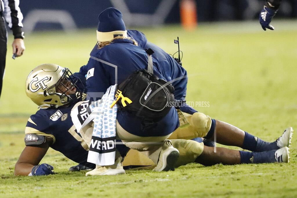 Members of the Georgia Tech training staff check on defensive lineman Antwan Owens (89) after he was injured in the second half of an NCAA college football game against the Pittsburgh Pittsburgh won 20-10. Saturday, Nov. 2, 2019, in Atlanta. (AP Photo/John Bazemore)