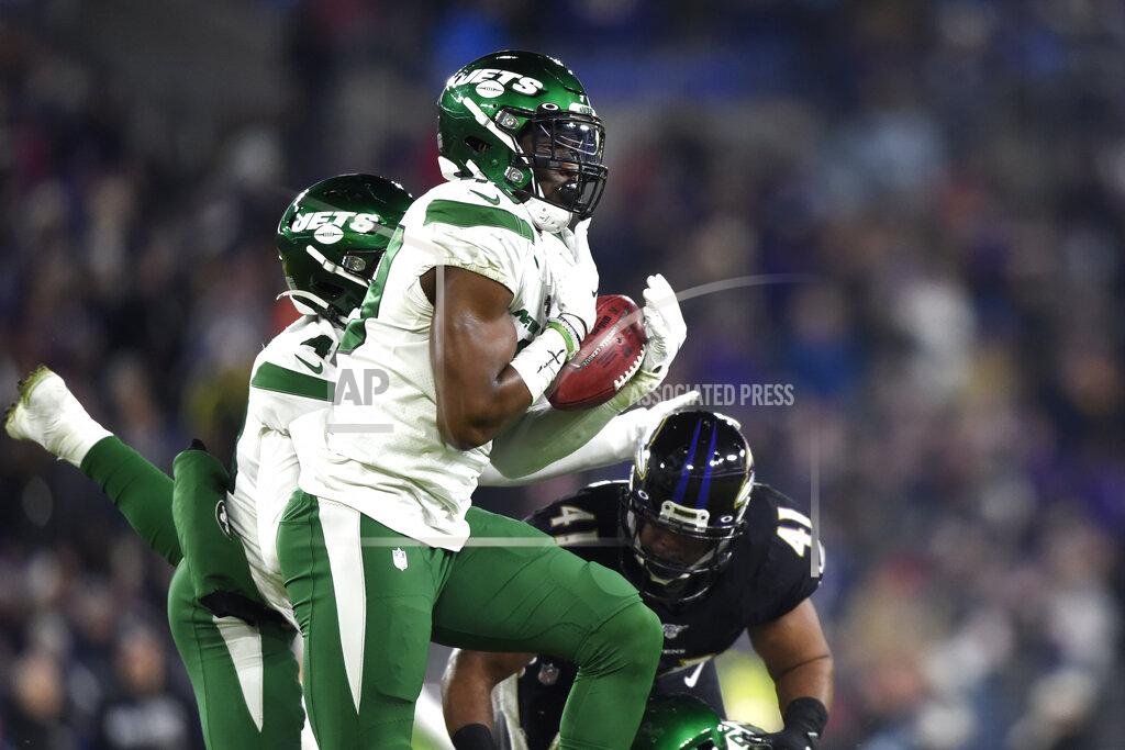 Gail Burton New York Jets linebacker B.J. Bello catches a blocked punt before returning it for a touchdown against the Baltimore Ravens during the second half of an NFL football game, Thursday, Dec. 12, 2019, in Baltimore. (AP Photo/Gail Burton)