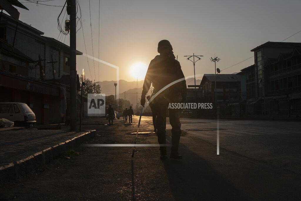 Dar Yasin Paramilitary soldiers patrol a deserted street on the first anniversary of India’s decision to revoke the disputed region’s semi-autonomy, in Srinagar, Indian controlled Kashmir, Wednesday, Aug. 5, 2020. Last year on Aug. 5, India’s Hindu-nationalist-led government of Prime Minister Narendra Modi stripped Jammu-Kashmir of its statehood and divided it into two federally governed territories. Late Tuesday, authorities lifted a curfew in Srinagar but said restrictions on public movement, transport and commercial activities would continue because of the coronavirus pandemic. (AP Photo/ Dar Yasin)