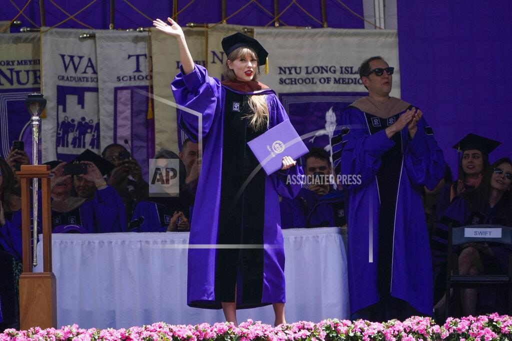 Seth Wenig Taylor Swift waves after receiving an honorary degree during a graduation ceremony for New York University at Yankee Stadium in New York, Wednesday, May 18, 2022. (AP Photo/Seth Wenig)