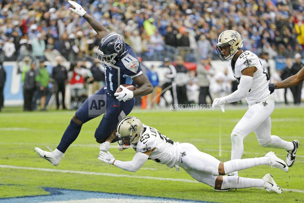 James Kenney Tennessee Titans wide receiver A.J. Brown (11) gets into the end zone past New Orleans Saints cornerback Marshon Lattimore (23) as Brown scores a touchdown on a 49-yard run in the first half of an NFL football game Sunday, Dec. 22, 2019, in Nashville, Tenn. (AP Photo/James Kenney)