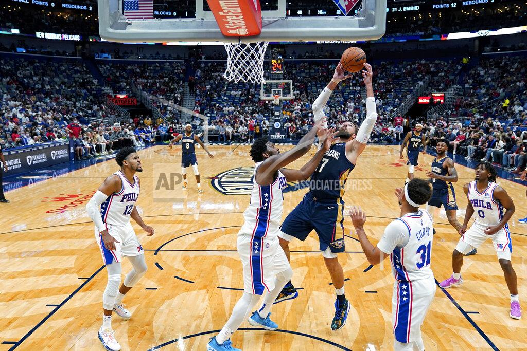 Gerald Herbert New Orleans Pelicans center Jonas Valanciunas pulls down an offensive rebound against Philadelphia 76ers center Joel Embiid in the first half of an NBA basketball game in New Orleans, Wednesday, Oct. 20, 2021. (AP Photo/Gerald Herbert)