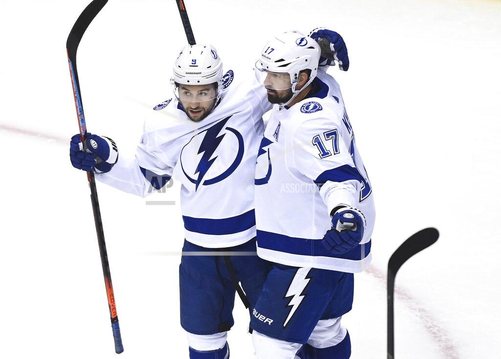 Nathan Denette Tampa Bay Lightning left wing Alex Killorn (17) celebrates his goal with teammate Tyler Johnson (9) while playing against the Boston Bruins during the first period of an NHL hockey playoff game Wednesday, Aug. 5, 2020 in Toronto. (Nathan Denette/The Canadian Press via AP)
