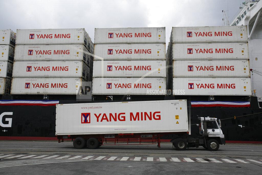 Wally Santana FILE - In this Dec. 15, 2008, file photo, a Taiwanese shipping company loads containers on a ship in the harbor of Keelung, Taiwan. Taiwan has applied to join an 11-nation Pacific trade group, Cabinet officials said Thursday, Sept. 23, 2021, setting up a potential clash with rival Beijing over the status of the island democracy. (AP Photo/Wally Santana, File)
