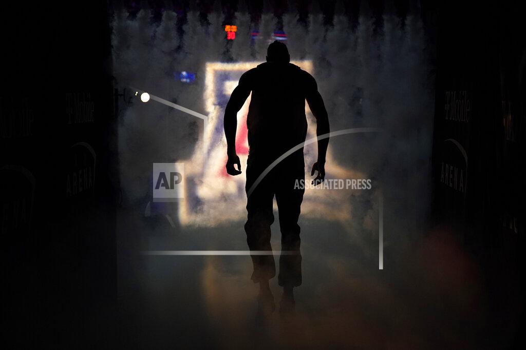 John Locher Arizona's Christian Koloko (35) runs onto the court before an NCAA college basketball game against Colorado in the semifinal round of the Pac-12 tournament Friday, March 11, 2022, in Las Vegas. (AP Photo/John Locher)