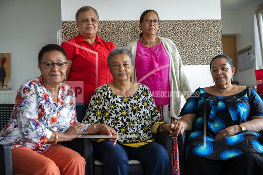 FILE - In this Monday, June 29, 2020 file photo, clockwise from top left, Simone Ngalula, Monique Bitu Bingi, Lea Tavares Mujinga, Noelle Verbeeken and Marie-Jose Loshi pose for a group photo during an interview with The Associated Press in Brussels. Five biracial women born in Congo when the country was under Belgian rule who were taken away from their Black mothers and separated from their African roots are suing the Belgian state for crimes against humanity. The case is being examined on hursday, Oct. 14, 2021 by a Brussels court. (AP Photo/Francisco Seco, File)