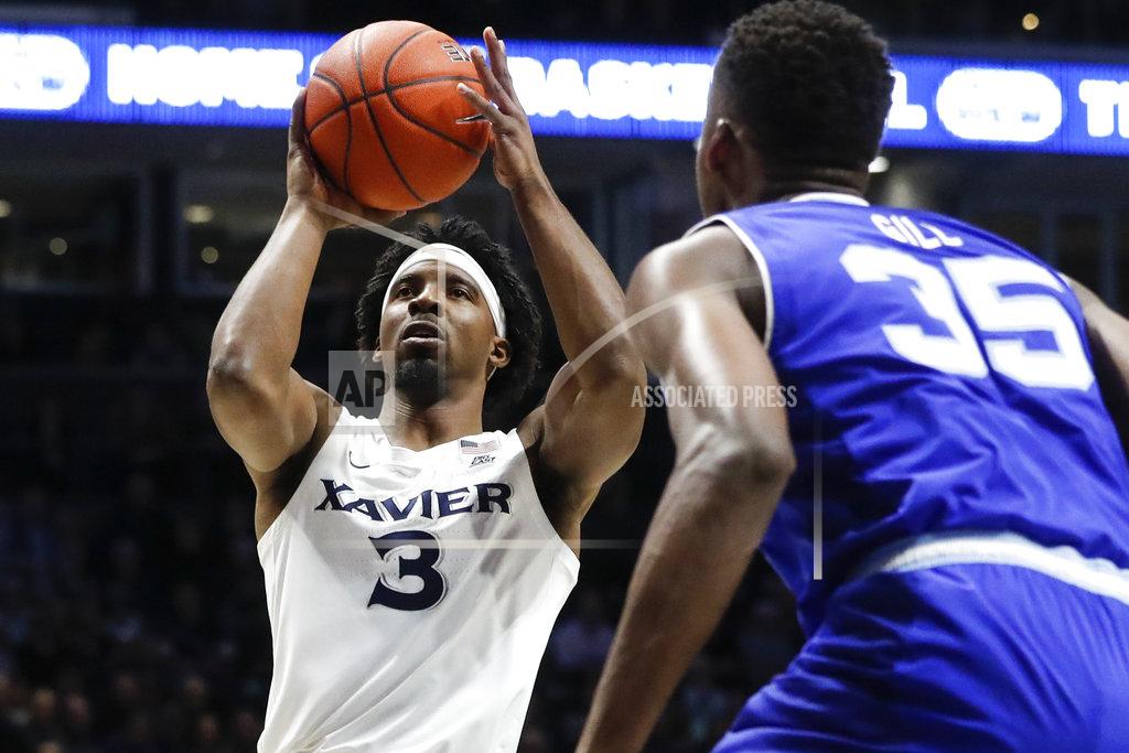 John Minchillo Xavier's Quentin Goodin (3) shoots as Seton Hall's Romaro Gill (35) watches during the first half of an NCAA college basketball game Wednesday, Jan. 2, 2019, in Cincinnati. (AP Photo/John Minchillo)