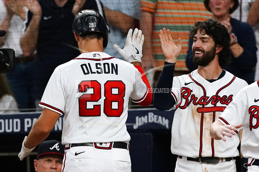John Bazemore Atlanta Braves' Matt Olson (28) is greeted at the dugout by Dansby Swanson, right, after hitting a two-run home run during the fourth inning of the team's baseball game against the New York Mets on Tuesday, Aug. 16, 2022, in Atlanta. (AP Photo/John Bazemore)