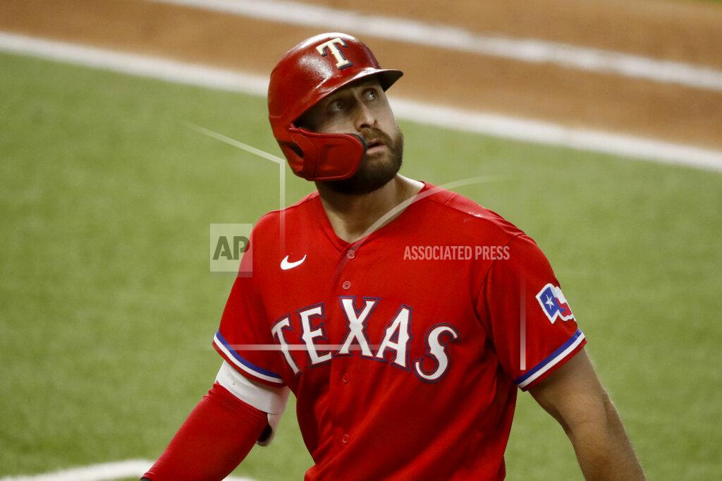 Roger Steinman Texas Rangers outfielder Joey Gallo looks up at a replay after flying out in the fifth inning of a baseball game against the Los Angeles Dodgers in Arlington, Texas, Sunday, Aug. 30, 2020. (AP Photo/Roger Steinman)