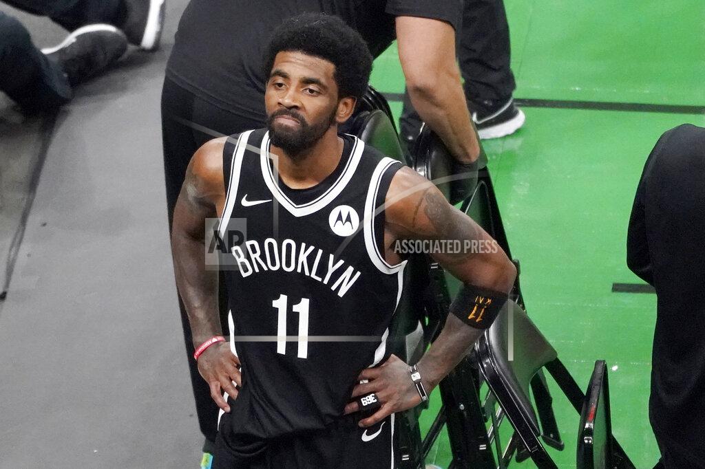Elise Amendola Brooklyn Nets guard Kyrie Irving looks up at the fans at TD Garden after they defeated the Boston Celtics in Game 4 during an NBA basketball first-round playoff series, Sunday, May 30, 2021, in Boston. Irving was booed and heckled by the fans all game. (AP Photo/Elise Amendola)