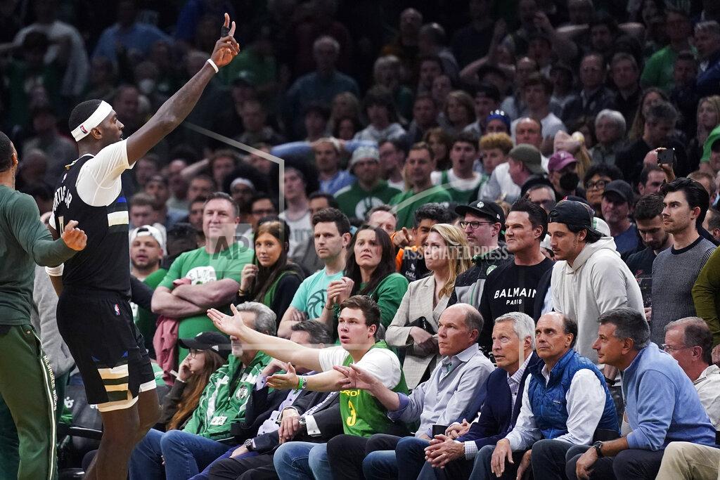 Charles Krupa Milwaukee Bucks center Bobby Portis, left, celebrates in front of stunned Boston Celtics fans after Game 5 of an Eastern Conference semifinal in the NBA basketball playoffs, Wednesday, May 11, 2022, in Boston. The Bucks won 110-107. (AP Photo/Charles Krupa)