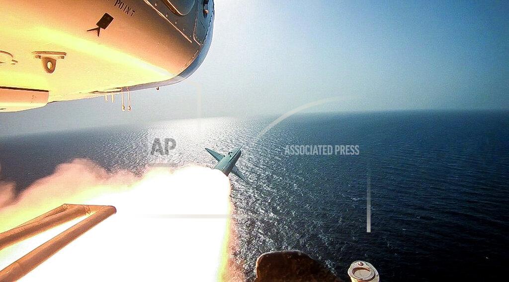 Uncredited In this photo released Tuesday, July 28, 2020, by Sepahnews, Revolutionary Guard's helicopter fires a missile during an exercise. Iran's paramilitary Revolutionary Guard fired a missile from a helicopter targeting a replica aircraft carrier in the strategic Strait of Hormuz, state television reported on Tuesday, an exercise aimed at threatening the U.S. amid tensions between Tehran and Washington. (Sepahnews via AP)