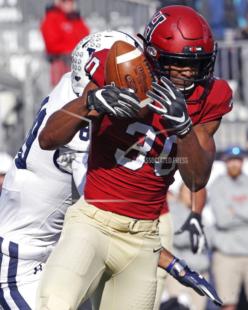 Charles Krupa Harvard safety Zach Miller (30) intercepts a pass intended for Yale tight end D. Major Roman, rear, during the first half an NCAA college football game at Fenway Park in Boston, Saturday, Nov. 17, 2018. (AP Photo/Charles Krupa)