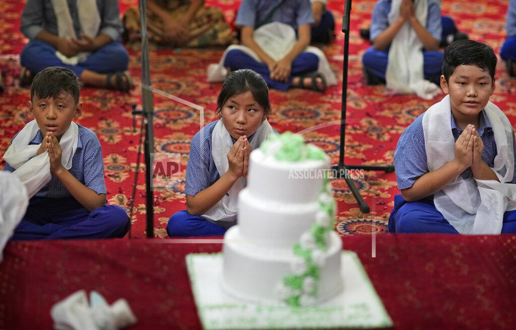 Manish Swarup Exile Tibetan Buddhist school children pray during a function to celebrate their spiritual leader Dalai Lama's 87th birthday, in New Delhi, Wednesday, July 6, 2022. (AP Photo/Manish Swarup)