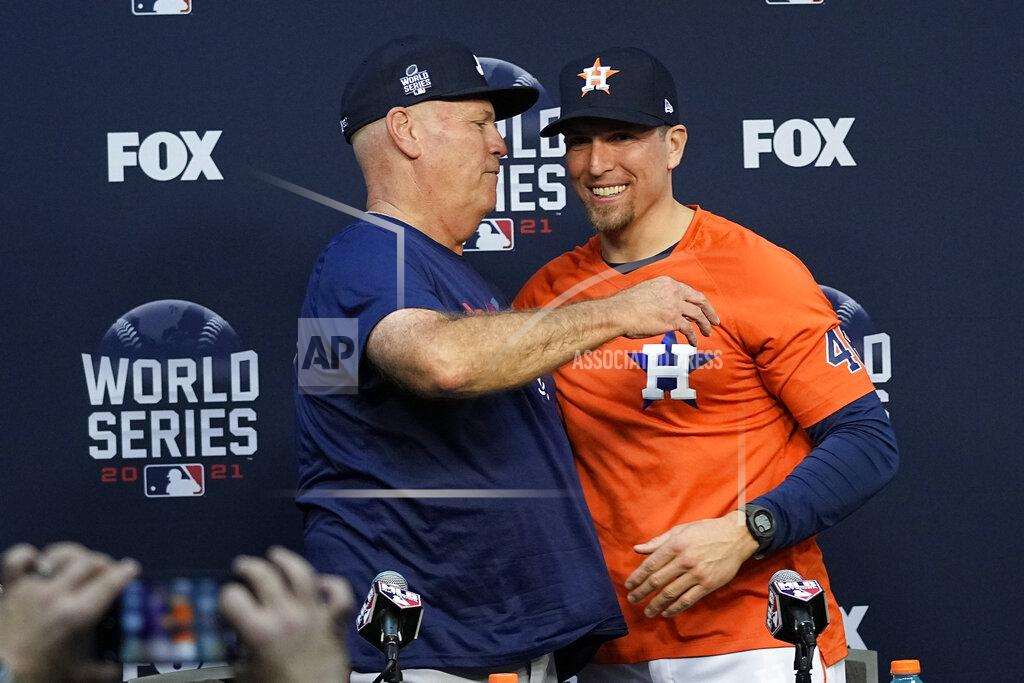 Ashley Landis Atlanta Braves manager Brian Snitker hugs Houston Astros hitting coach Troy Snitker after a news conference before Game 1 of baseball's World Series Tuesday, Oct. 26, 2021, in Houston. (AP Photo/Ashley Landis)