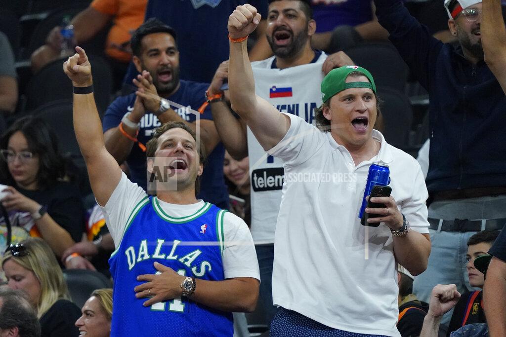 Matt York Dallas Mavericks fans cheer during the second half of Game 7 of an NBA basketball Western Conference playoff semifinal against the Phoenix Suns, Sunday, May 15, 2022, in Phoenix. The Mavericks defeated the Suns 123-90. (AP Photo/Matt York)