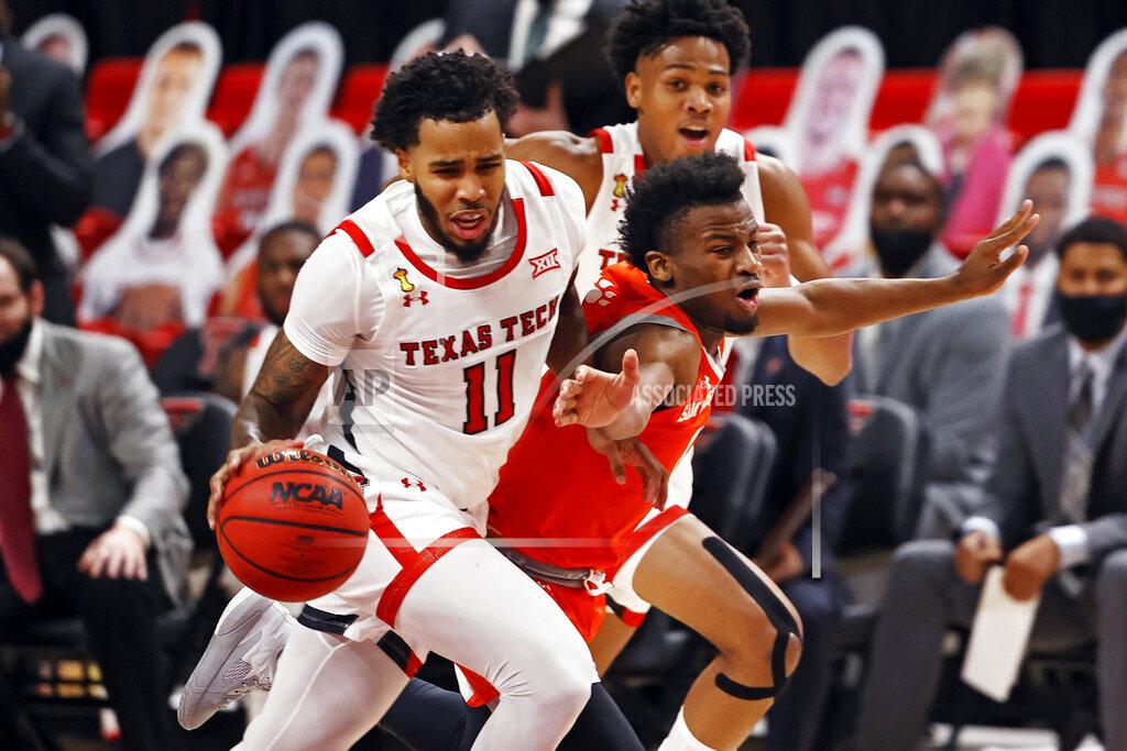 Brad Tollefson Texas Tech's Kyler Edwards (11) dribbles the ball past Sam Houston State's Bryce Monroe (0) during the first half of an NCAA college basketball game Friday, Nov. 27, 2020, in Lubbock, Texas. (AP Photo/Brad Tollefson)