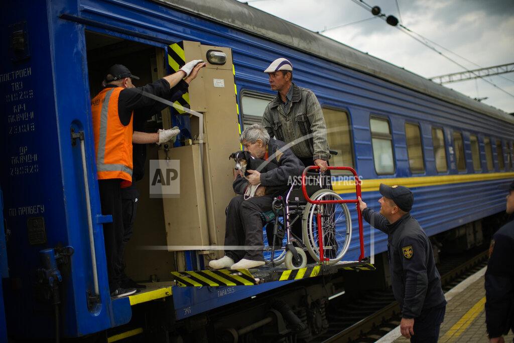 Francisco Seco People fleeing from shelling board an evacuation train at the train station, in Pokrovsk, eastern Ukraine, Sunday, May 22, 2022. Civilians fleeing areas near the eastern front in the war in Ukraine Sunday described scenes of devastation as their towns and villages came under attack from Russian forces. (AP Photo/Francisco Seco)