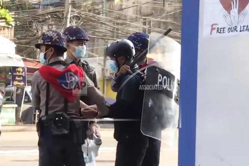 Uncredited FILE - In this file image made from video taken on Feb. 27, 2021, Associated Press journalist Thein Zaw is arrested by police in Yangon, Myanmar. A court in Myanmar extended on Friday, March 12, 2021, the pretrial detention of an Associated Press journalist who was arrested while covering demonstrations against a coup. He is facing a charge that could send him to prison for three years. His next hearing will be on March 24. (AP Photo/File)