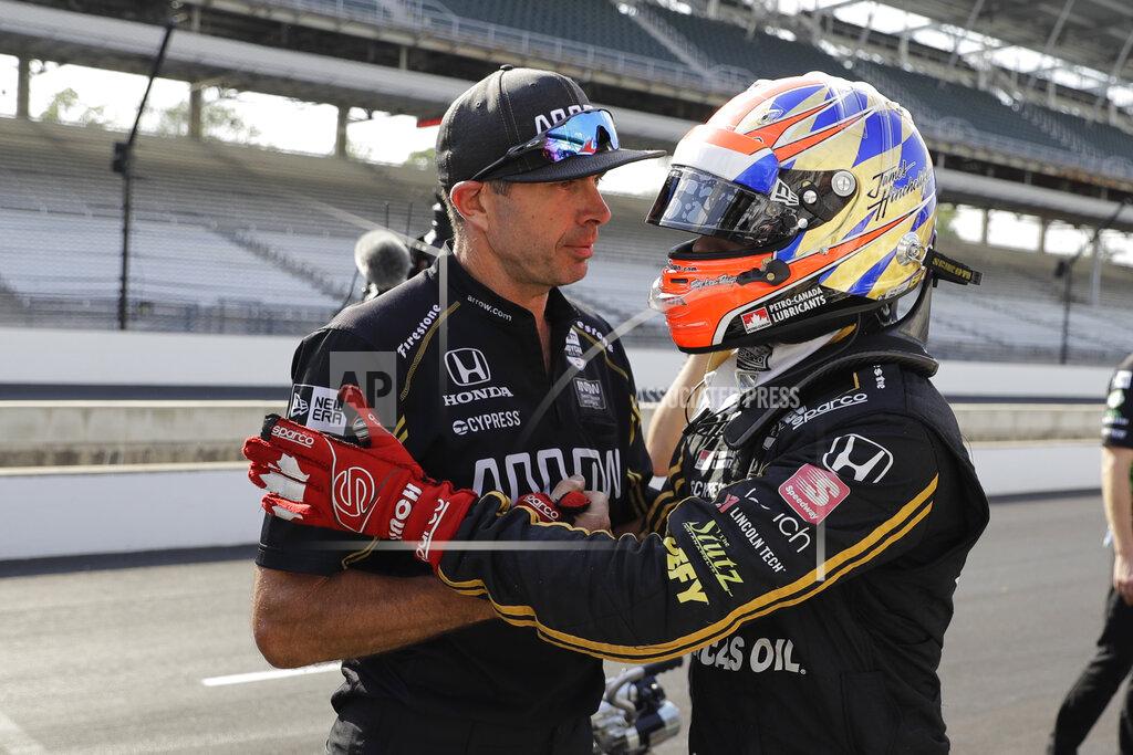 Darron Cummings James Hinchcliffe, of Canada, talks with a crew member during qualifications for the Indianapolis 500 IndyCar auto race at Indianapolis Motor Speedway, Saturday, May 18, 2019 in Indianapolis. (AP Photo/Darron Cummings)