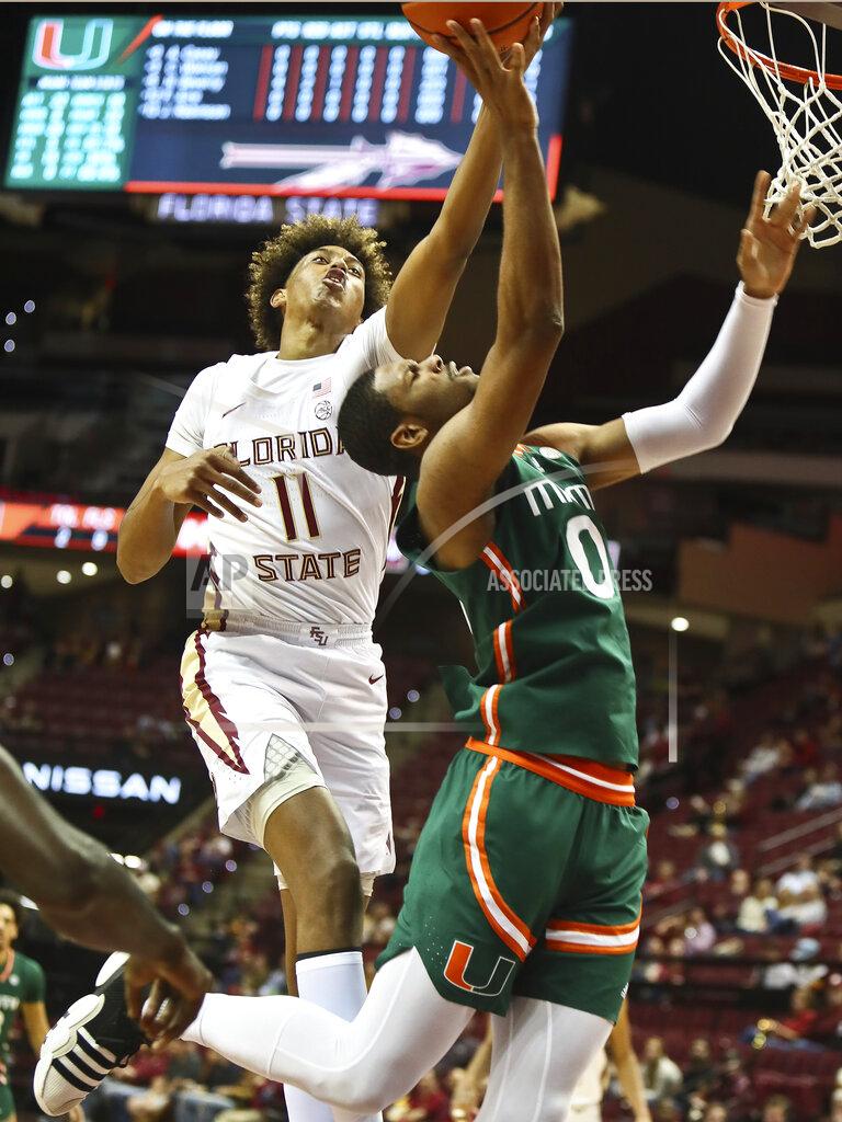 Phil Sears Florida State forward Baba Miller (11) rejects a layup by Miami forward AJ Casey (0) in the second half of an NCAA college basketball game in Tallahassee, Fla., Tuesday, Jan. 24, 2023. (AP Photo/Phil Sears)