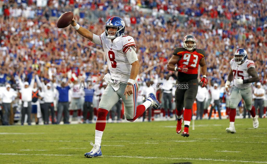 Mark Lomoglio New York Giants quarterback Daniel Jones (8) scores on a 7-yard touchdown run against the Tampa Bay Buccaneers during the second half of an NFL football game Sunday, Sept. 22, 2019, in Tampa, Fla. (AP Photo/Mark LoMoglio)