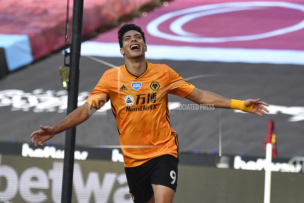 Ben Stansall Wolverhampton Wanderers' Raul Jimenez celebrates after scoring his side's first goal during the English Premier League soccer match between West Ham and Wolverhampton at London stadium in London, England, Saturday, June 20, 2020. (Ben Stansall/Pool via AP)