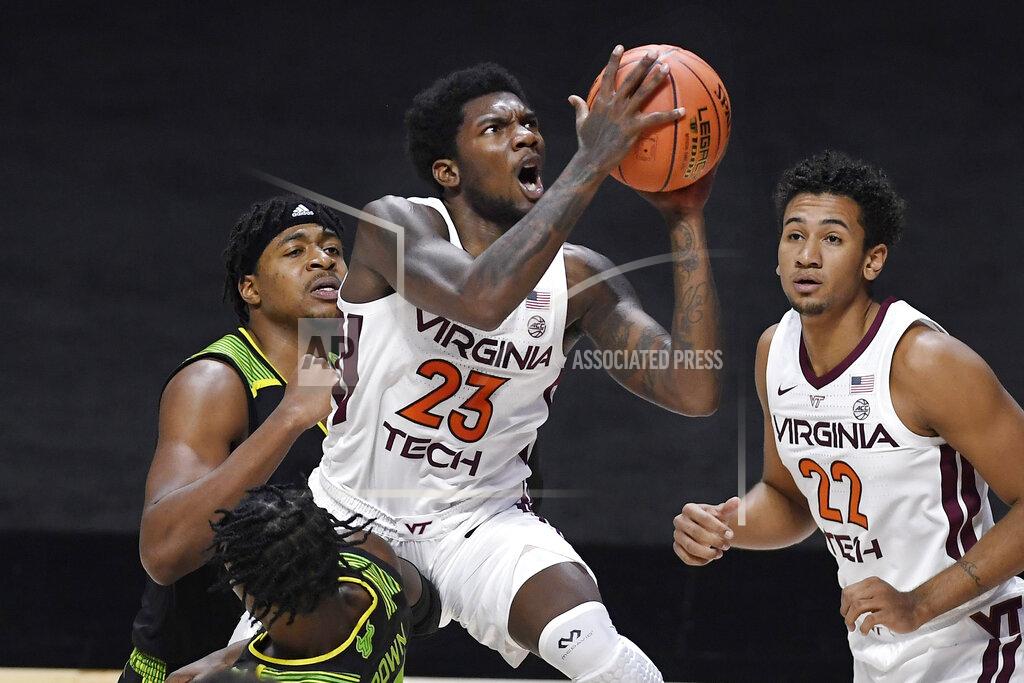 Jessica Hill Virginia Tech's Tyrece Radford is fouled by South Florida's Justin Brown, bottom, as he shoots in the second half of an NCAA college basketball game, Sunday, Nov. 29, 2020, in Uncasville, Conn. (AP Photo/Jessica Hill)