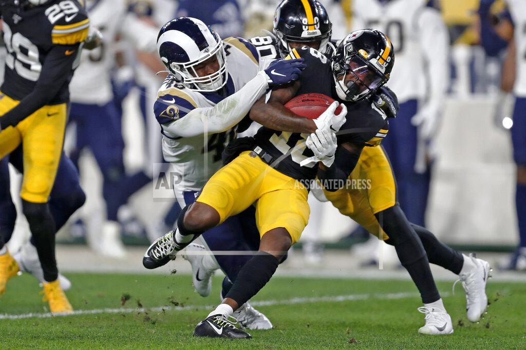 Keith Srakocic Pittsburgh Steelers wide receiver Diontae Johnson (18) is tackled by Los Angeles Rams linebacker Travin Howard (48) during the first half of an NFL football game in Pittsburgh, Sunday, Nov. 10, 2019. (AP Photo/Keith Srakocic)