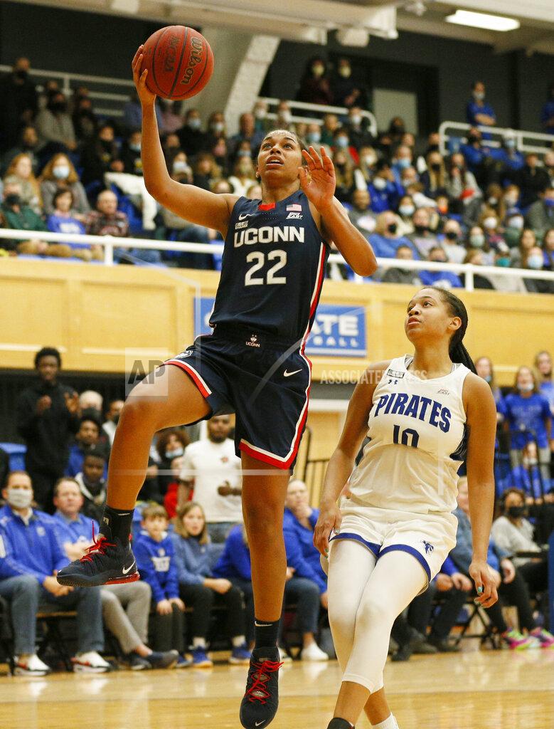 Noah K. Murray Connecticut guard Evina Westbrook (22) drives to the basket against Seton Hall forward Mya Bembry (10) during the second half of an NCAA college basketball game on Friday, Dec. 3, 2021, in South Orange, N.J. (AP Photo/Noah K. Murray)
