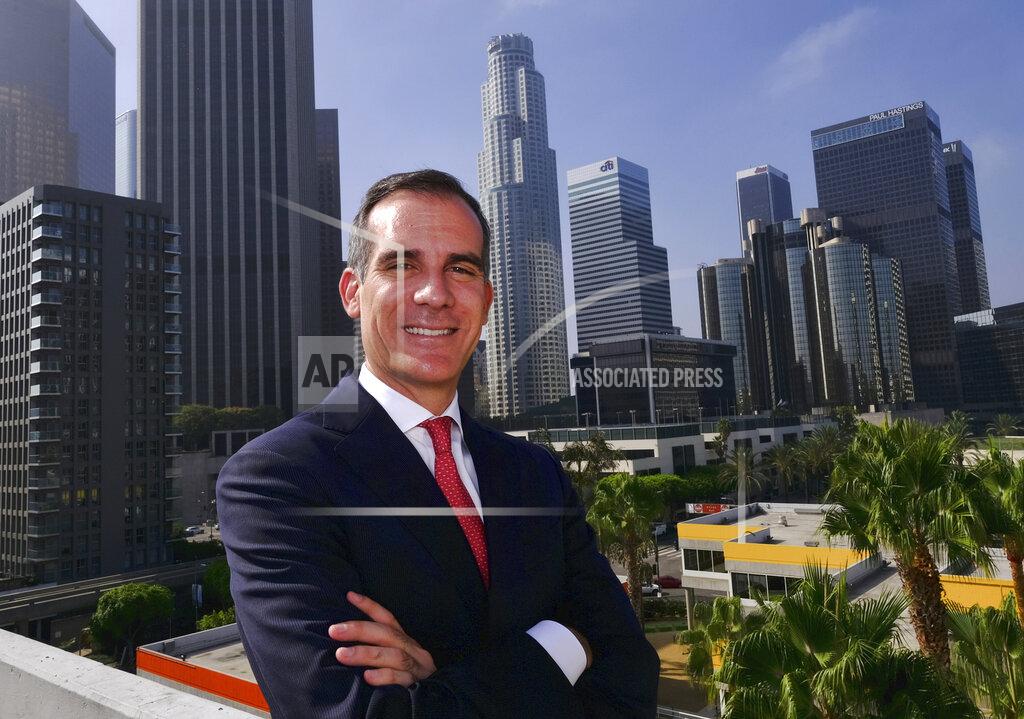 Richard Vogel FILE - In this Aug. 23, 2018, file photo, Los Angeles Mayor Eric Garcetti poses in front of a sprawling downtown Los Angeles landscape. Garcetti has taken his name out of consideration for a possible post in the Biden administration. (AP Photo/Richard Vogel, File)