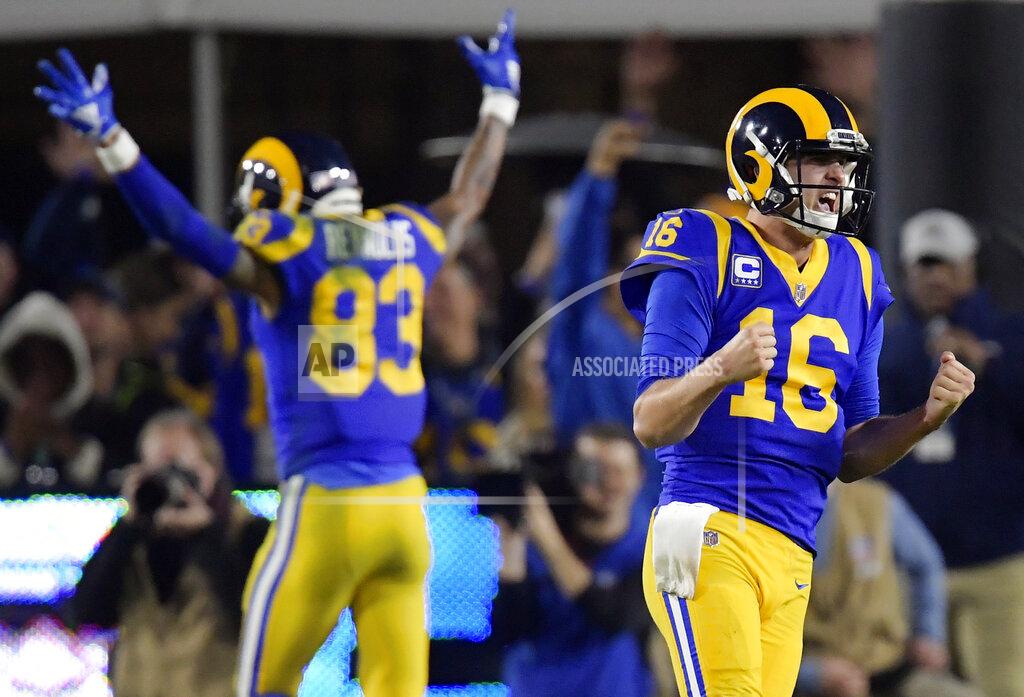 Mark J. Terrill FILE - In this Jan. 12, 2019, file photo, Los Angeles Rams quarterback Jared Goff celebrates after a touchdown by running back C.J. Anderson during the second half in an NFL divisional football playoff game against the Dallas Cowboys in Los Angeles. The wide-eyed, talented Goff will try to lead his Rams past the grizzled, 41-year-old Tom Brady, who is looking to guide the Patriots to their sixth Super Bowl victory. (AP Photo/Mark J. Terrill, File)
