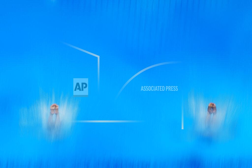 Morry Gash China's Wang Zongyuan and Xie Siyi compete during men's synchronised 3-meter springboard at the 2020 Summer Olympics, Monday, July 26, 2021, in Tokyo, Japan. (AP Photo/Morry Gash)