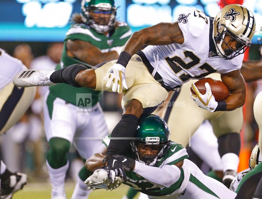 Adam Hunger New York Jets' Brian Poole tackles New Orleans Saints' Dwayne Washington (27) during the first half of a preseason NFL football game Saturday, Aug. 24, 2019, in East Rutherford, N.J. (AP Photo/Adam Hunger)