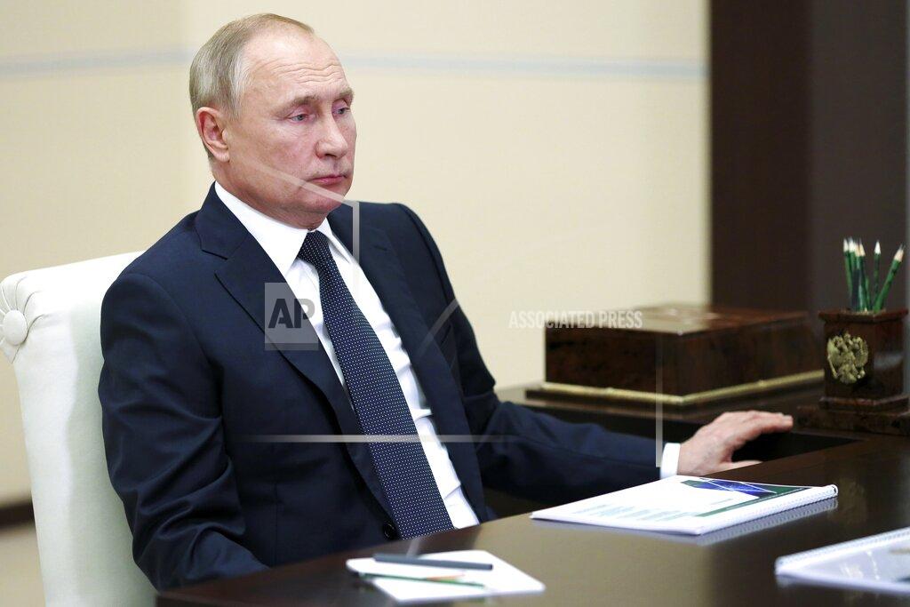 Evgeniy Paulin Russian President Vladimir Putin attends a meeting via video conference at the Novo-Ogaryovo residence outside Moscow, Russia, Monday, Oct. 25, 2021. Putin has ordered Russians not to go to work between Oct. 30 and Nov. 7. Russian authorities hope the non-working period will help limit the spread of the virus by keeping people out of offices and off public transportation. (Evgeniy Paulin, Sputnik, Kremlin Pool Photo via AP)